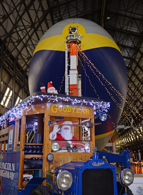 The Goodyear Blimp and the U.S. Marine Corps Reserve Toys for Tots welcome Santa to greet guests donating toys to the program.