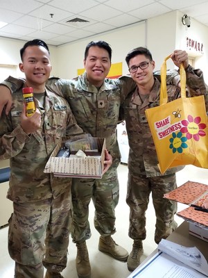 Military members receiving Sue Bee honey packages.