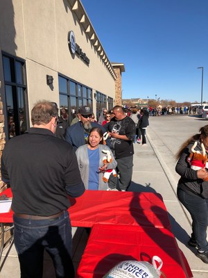 Tony Atterbury handing out Turkeys at The Bull Attorneys annual Thanksgiving Turkey Giveaway in Garden City, KS.