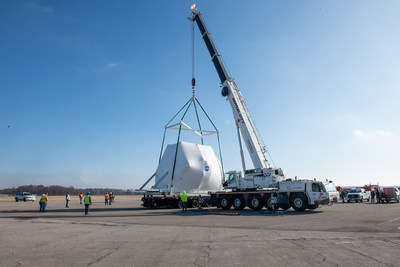 The Orion spacecraft being lifted onto the truck for transport to NASA's Plum Brook Station. Credit: NASA.