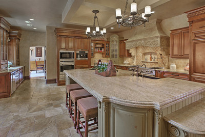 The main kitchen offers everything a chef needs, and is located adjacent to a fireplace lounge area and family room. Another kitchen is located on the lower living level. NewJerseyLuxuryAuction.com.