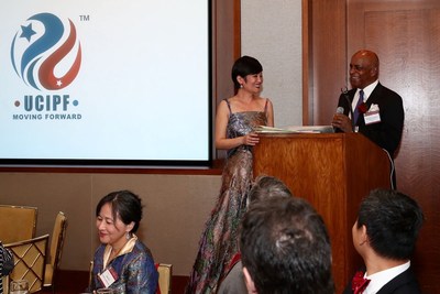 The US-China Intellectual Property Exchange and Development Foundation was officially launched in New York on Tuesday. Demi Wang (left), the foundation's CEO, invites Richard H. Glanton, the foundation's chairman of the board and CEO of ElectedFace, to deliver the opening speech. PROVIDED TO CHINA DAILY