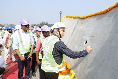 Mr Vinayak Deshpande, Managing Director, Tata Projects Ltd signing the first concrete section