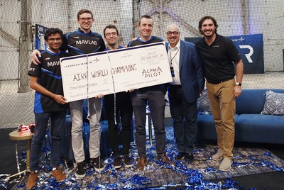 AIRR World Champions, Team MAVLab, receive $1mm cash prize from Lockheed Martin SVP of Communications, Dean Acosta, and AlphaPilot Program Manager, Keith Lynn.