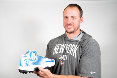 Nate Solder holding his Compassion Cleats for the NFL's My Cause My Cleats campaign.