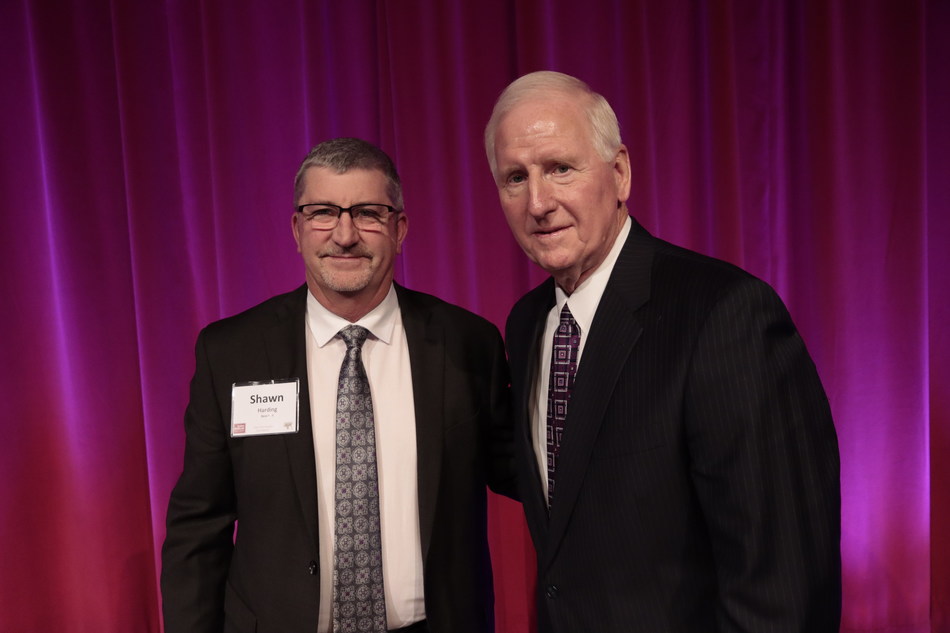 President Shawn Harding, left, with former President Larry Wooten