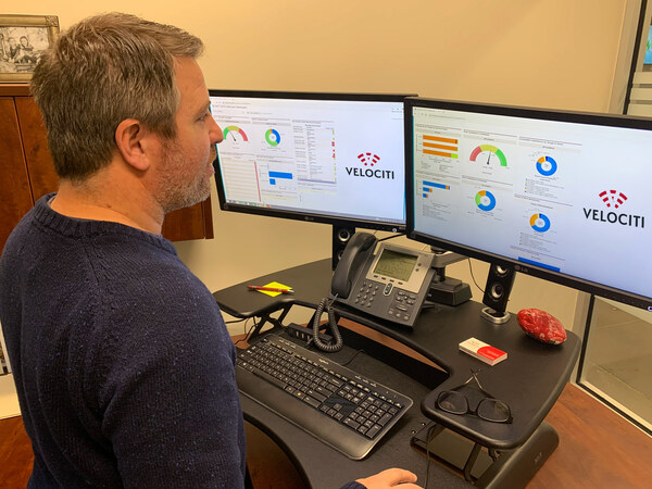 A Velociti team member reviews MVT’s VeloCare proactive system health monitoring dashboards.