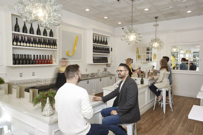 Guests enjoy flights of wine at the J Vineyards & Winery Holiday Wine Shop at Stanford Shopping Center in Palo Alto, Calif.