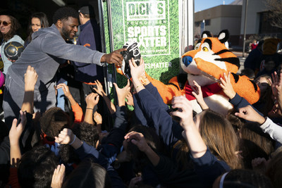 Football Hall of Famer LaDainian Tomlinson, Tony the Tiger and reps from The DICK'S Sporting Goods Foundation announced today that every public middle school in El Paso, TX will receive a Sports Matter grant--totaling $500,000--on behalf of Kellogg's Frosted Flakes' Mission Tiger and The DICK'S Sporting Goods Foundation's Sports Matter. The duo teamed to help give El Paso middle schoolers the chance to play sports, delivering truckloads of new equipment. (Jorge Salgado/AP Images for Kellogg's)