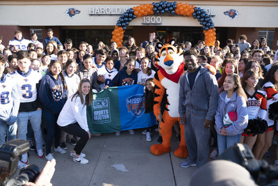 Football Hall of Famer LaDainian Tomlinson, Tony the Tiger and reps from The DICK'S Sporting Goods Foundation announced today that every public middle school in El Paso, TX will receive a Sports Matter grant--totaling $500,000--on behalf of Kellogg's Frosted Flakes' Mission Tiger and The DICK'S Sporting Goods Foundation's Sports Matter. The duo teamed to help give El Paso middle schoolers the chance to play sports, delivering truckloads of new equipment. (Jorge Salgado/AP Images for Kellogg's)