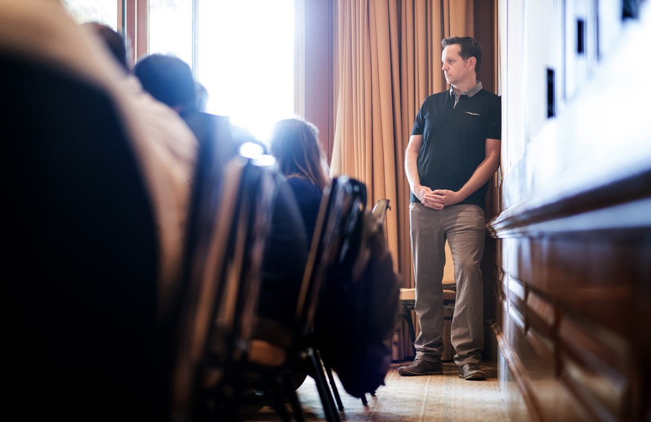 SmartBug Media's Founder and CEO, Ryan Malone, looks on during a presentation as his remote workforce gathers for its annual SmartBugapalooza team building retreat.