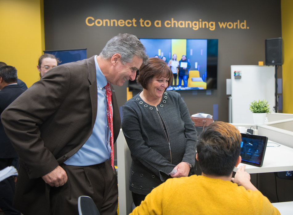 On Monday, December 16th, Synchrony CEO Margaret Keane and UConn President Tom Katsouleas spoke with a UConn student on his tech project at UConn Stamford’s new Digital Technology Center (DTC). The DTC is part of Synchrony and UConn’s expanded partnership to help prepare students for tech careers. Synchrony also announced a $1 million gift to UConn’s Connecticut Commitment program that provides free tuition to low-income students. From left to right: UConn President Tom Katsouleas, Synchrony CEO Margaret Keane, and UConn student and DTC intern Charlie Ira (Photo credit: Synchrony)