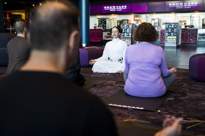 People participate in Jedi Yoga ahead of the Star Wars Marathon at the Showcase Cinema de Lux Legacy Place in Dedham, MA.