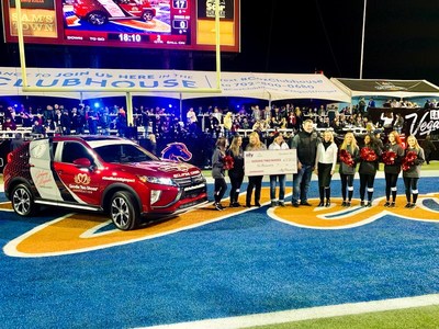 Halftime at the 2019 Mitsubishi Motors Las Vegas Bowl: Mitsubishi Motors and Ally Financial present a 2020 Mitsubishi Eclipse Cross “Community Utility Vehicle” and $10,000 to Nikki and Tony Berti, founders of the Goodie Two Shoes Foundation, which provides shoes and socks to disadvantaged children in Southern Nevada.