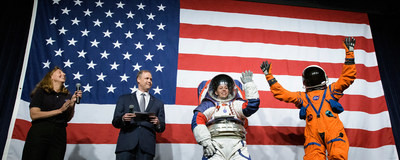 NASA spacesuit engineer Amy Ross and NASA Administrator Jim Bridenstine introduce spacesuit engineer Kristine Davis, wearing a ground prototype of NASA’s new Exploration Extravehicular Mobility Unit (xEMU), and Orion Crew Survival Systems Project Manager Dustin Gohmert, wearing the Orion Crew Survival System suit, Oct. 15, 2019 at NASA Headquarters in Washington. Credit: NASA