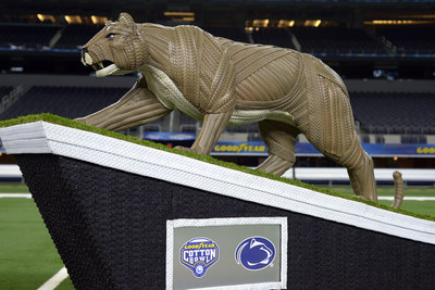 Goodyear introduces a life-sized tire mascot sculpture of the Penn State University Nittany Lion on Thursday, Dec. 26, 2019, at AT&T Stadium in Arlington, Texas. Standing five feet tall and made from more than 100 Goodyear tires, the Penn State Nittany Lion sculpture took over 200 total hours to complete. The statue recognizes the drive and effort of the Penn State University players and coaches for advancing to the 84th annual Goodyear Cotton Bowl Classic. (Matt Strasen/AP Images for Goodyear)