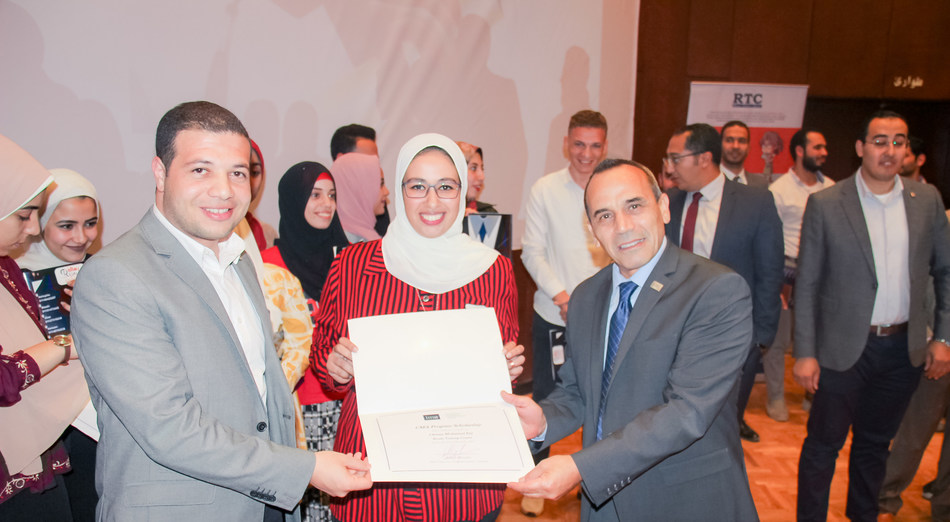 Left to right: Mostafa Araby - Founder of the CMA teaching program at Resala and Senior Financial Analyst at General Motors Egypt, Omnia Ezz - an accountant and Resala student receiving her CMA scholarship and Ahmad Mkhallati - IMA Director of Regional Partner Relationships