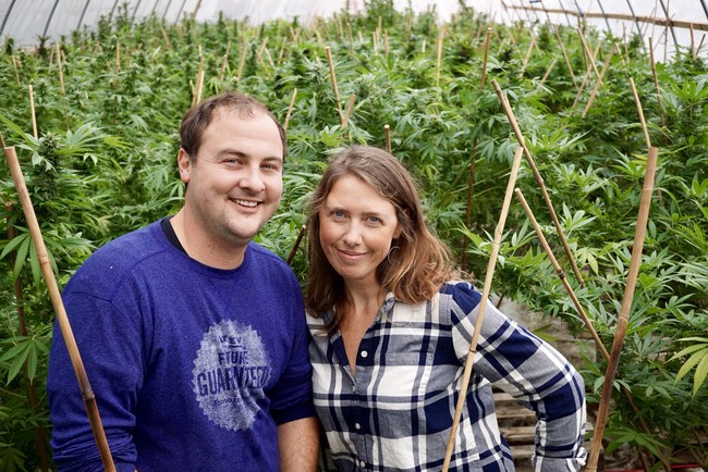 Sweet Dirt founders, Hughes and Kristin Pope, in an early Sweet Dirt greenhouse pre-dating the soon-to-be-built 32,800 sq ft structure.