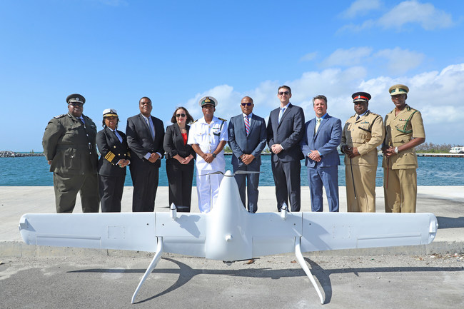 Clarence Russell, Director of Immigration; Dr. Geannie Moss, Comptroller of Customs; Eugene Poitier, Permanent Secretary, Ministry of National Security; Charge d'Affaires Stephanie Bowers; Capt. Raymond King, Acting Cmdr Defence Force; The Hon. Marvin Dames, Minister of National Security; Rick Heise, Swift Tactical CEO; Alex Echeverria, Swift VP of Ops; Anthony Ferguson, Commissioner of Police; and Charles Murphy, Commissioner of Dept of Correctional Svcs. (Photo by Marine Michael Turner II)