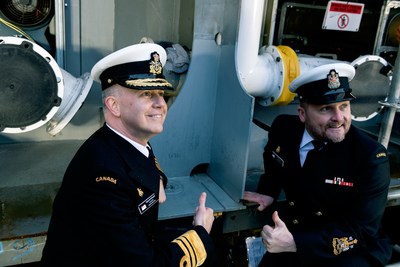 Vice-Admiral Art McDonald, Commander of the Royal Canadian Navy (left) beside Command Chief Petty Officer First Class David Steeves (right) laying the ceremonial coin on the future HMCS  Protecteur's keel (CNW Group/Seaspan Shipyards)