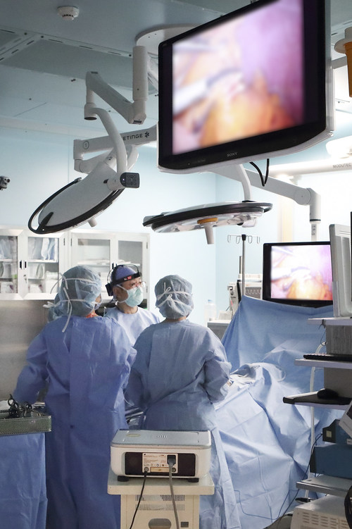 Medical staff at the Samsung Medical Center wear sync cams to proceed surgery of a patient