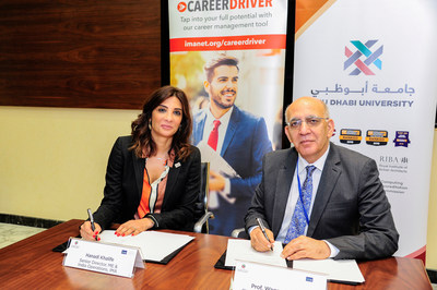 Hanadi Khalife, senior director of MEA and India operations at IMA appears with Prof. Waqar Ahmad Chancellor of ADU during the signing ceremony