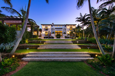 Lush, mature landscaping and custom lighting dotted throughout the +1-acre parcel create a serene and tropical atmosphere. MiamiLuxuryAuction.com.