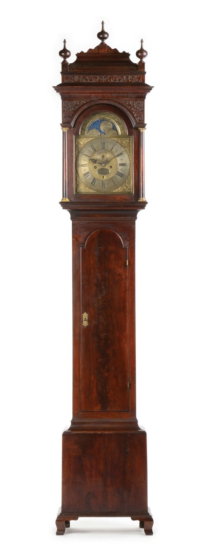 Circa-1740 Philadelphia tall-case 8-day moon-phase clock signed by Peter Stretch. Earliest known clock of its type with ogee feet. Sold for $166,050, more than twice the high estimate