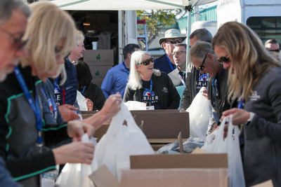 Farmers Insurance volunteers participate in the Armed Services YMCA Neighborhood Food Exchange program on January 23, 2020 as part of the Farmers Insurance Open.