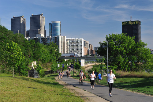 Philadelphia, USA - May 18, 2012. People doing exercise in Schuylkill Banks Park in the center city of Philadelphia, Pennsylvania. Philadelphia is the largest city in Pennsylvania and attracts lots of visitors for its historic landmarks like Independence Hall and Liberty Bell.