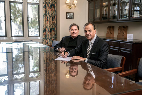 Loyola High School of Los Angeles President Fr. Gregory M. Goethals, SJ '73 (left) and Loyola Board Chair, business innovator, civic leader and philanthropist Rick J. Caruso (right) at the signing of Mr. Caruso and his wife Tina Caruso's $5 million gift to the Jesuit preparatory school.