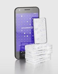 $500,000 worth of Diamond Standard Bars, the first regulator-approved standardized diamond commodity, shown with a smartphone application used for authentication and blockchain transactions.