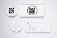 Photo of a Diamond Standard Coin and Bar. 
The first and only regulator-approved, standardized diamond commodity.
Inside each coin, along with the fungible set of certified natural diamonds, is a wireless encryption chip, used for auditing, authentication and blockchain-based transactions.