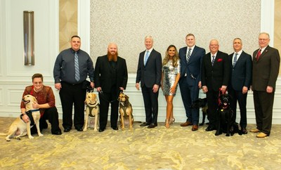 Saving America's Vets...and America's Pets (left to right): Former USMC Lance Corporal Alicia with service dog Gabriel; former US Army Spc Michael with service dog Murphy; retired US Army Sgt. Joseph with service dog Nattie; US Army Major General James A. Marks (Ret.); American Humane President & CEO Dr. Robin Ganzert; former US Army Spc Matthew with service dog Simba; USAF veteran Senior Airman Kris with service dog Andi; USN Rear Admiral Thomas Kearney (Ret.); and Coleman Natural Foods VP Mel Coleman.