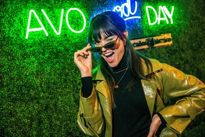 Laurie Bing struck a pose under the lights of the AvoEatery Avo Good Day sign. Credit: Randy Anderson