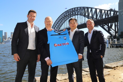 Representatives from AETOS Capital Group and Sydney FC co-present the new season team Jersey. (PRNewsfoto/AETOS Capital Group)