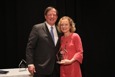 Cox Automotive President Sandy Schwartz presents Liza Myers Borches the 2020 Barbara Cox Woman of the Year Award.