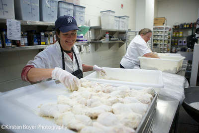 School food professionals prepare oven-baked whole chicken breast.
