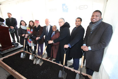 Members of the Interfaith Housing Development Corporation, the project's design and construction teams, the Village of Maywood, and from Cook County celebrate at the Fifth Avenue Apartments' groundbreaking ceremony.