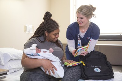 Tiffany Hawkins holds her newborn, Royalty, as nurse Kelsey Jones explains Welcome Bluff City Baby, a pilot program in partnership with Methodist Le Bonheur Healthcare, Urban Child Institute and Read901 that gives backpacks filled with early reading developmental materials to the families of babies born at Methodist South Hospital.