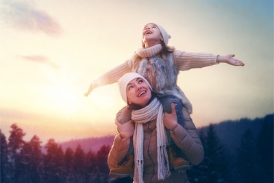Mother and Daughter enjoy healthy outdoor fun in winter