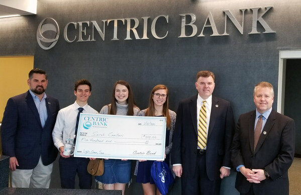 Centric Bank’s first-place winner of Lights, Camera, Save!, Sarah Camilleri, Spring-Ford High School, Montgomery County, received her $500 prize at the Devon Financial Center along with her production crew. L to R: Centric Bank Market Leader Main Line Christopher Bickel, Nick Elsner, McKinley Linn, Sarah Camilleri (winner), Centric Bank Director of Cash Management and Treasury Services Timothy Merrell, and Devon Financial Center Manager Martin Haenn.