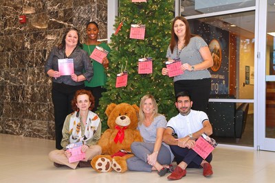 Smart Financial staff in front of Giving Tree