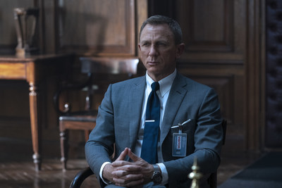 PHOTO CAPTION: B25_11846_RCJames Bond (Daniel Craig) inNO TIME TO DIE,an EON Productions and Metro Goldwyn Mayer Studios film Credit: Nicola Dove© 2020 DANJAQ, LLC AND MGM. ALL RIGHTS RESERVED.PRODUCT DETAILS: TOM FORD Grey Wool Prince of Wales Check O’Connor Notch Lapel Jacket, O’Connor Tailored Trousers, White Poplin Collared Shirt, Dark Blue Diagonal Silk Tie and Off White Silk Pocket Square