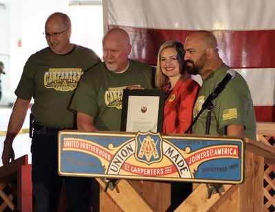 SWRCC EST Dan Langford, SWRCC VP Frank Hawk, and SWRCC President Pete Rodriguez accept a proclamation from Phoenix Mayor Kate Gallego designating February 29th as Solidarity Day in Phoenix.