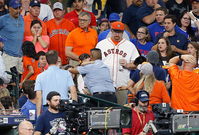 Shocked fans watch as a young child is rushed from the stands after being injured by a foul ball at Minute Maid Park on May 29, 2019 in Houston, Texas. (Photo by Bob Levey/Getty Images)