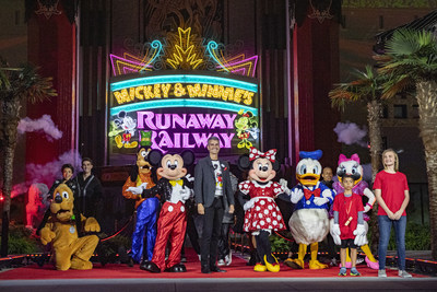 Walt Disney World Resort President Josh D’Amaro (center) is joined by Mickey Mouse, Minnie Mouse and other Disney pals, March 3, 2020, during the dedication ceremony for Mickey & Minnie’s Runaway Railway at Disney’s Hollywood Studios at Walt Disney World Resort in Lake Buena Vista, Fla. The new attraction opens to the public March 4, 2020. (David Roark, photographer)