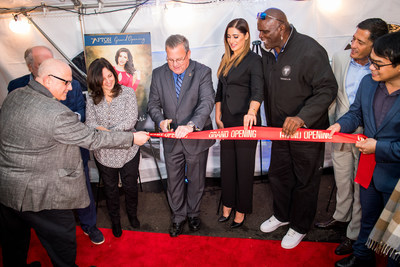 Florham Park, NJ's Mayor Mark Taylor cuts the ribbon to officially open NRIA's luxury townhome community Afton of Morris.  Mayor Taylor is assisted by American actress and model Nargis Fakhri (to his right) and NFL legend Lawrence Taylor (right of Fakhri).