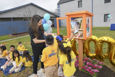 Preschool students visit the 100,000th Little Free Library book-sharing box, located at AAMA in Houston. The Little Free Library nonprofit organization is donating an additional 100 little libraries to sites that will increase book access for children.