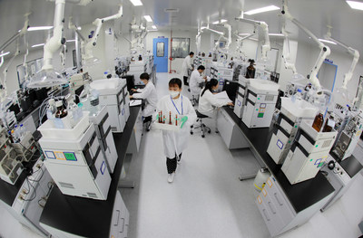 Drug inspectors test Favipiravir tablets at the Quality Control Centre of Zhejiang Hisun Pharmaceutical Co., Ltd.